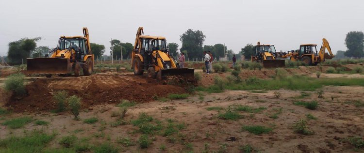 यूआईटी द्वारा अवैध प्लॉटिंग के विरूद्ध कार्रवाई कर कृषि भूमि पर से हटाया अतिक्रमण